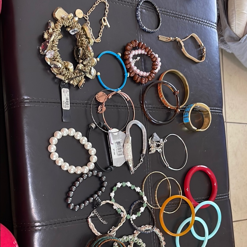 Gold and Silver Bracelet and Bangle Collection with Beaded and Chain Designs.